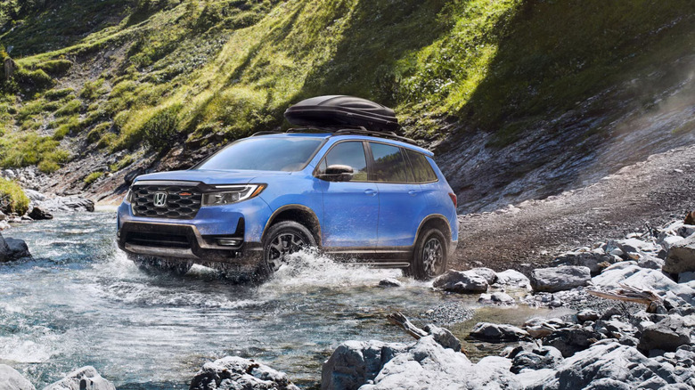 2025 Honda Passport shown in an off-road environment