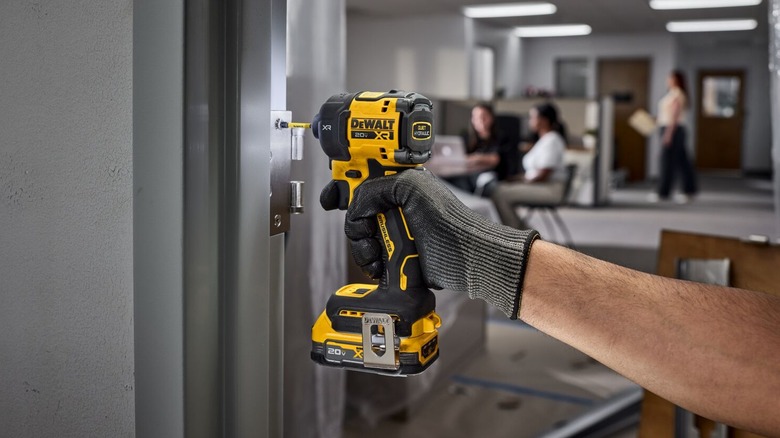 A Brushless 20V DeWalt Impact Driver being used in an office