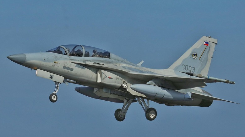 Phillipine Air Force FA-50 fighter jet seen from the left against a blue sky