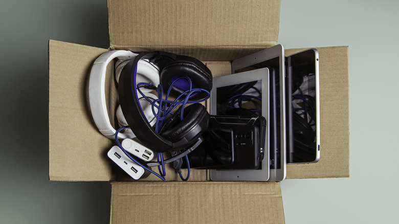 Old gadgets in cardboard box