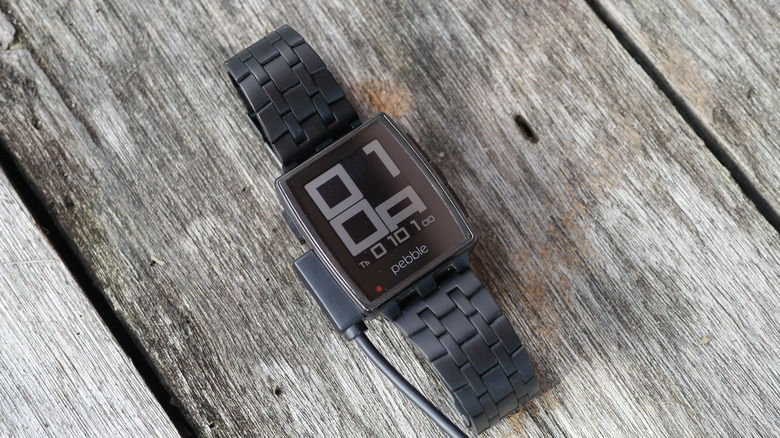 Pebble smartwatch on wooden table