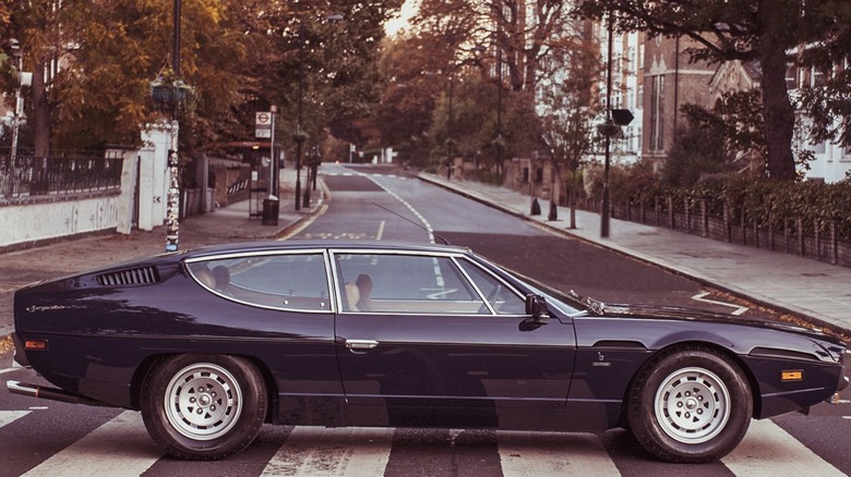 Black Lamborghini Espada parked on Abbey Road in London