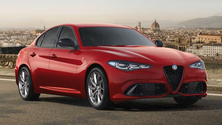 A red Alfa Romeo Giulia on the road