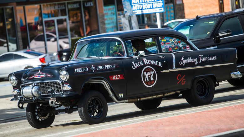 Black tri-five chevy on drag race strio