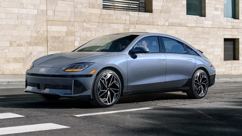 A grayish blue Hyundai IONIQ 6 parked on a city street