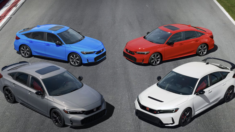 Four Honda Civics on a road together