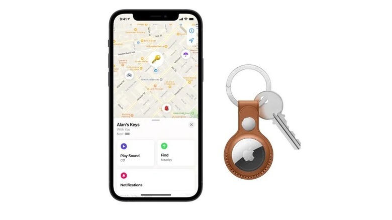 An airtag on a keychain with a phone showing where it can be found.