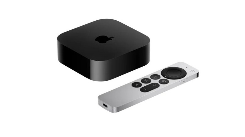 An Apple TV 4K (3rd Generation) box next to its remote.