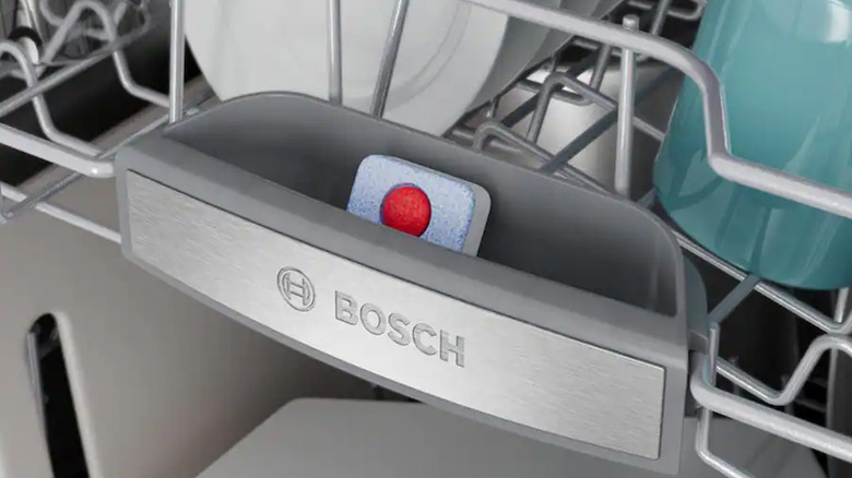 The top rack of a Bosch dishwasher with the logo showing