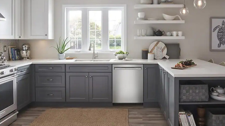 A neutral colored kitchen with a KitchenAid dishwasher
