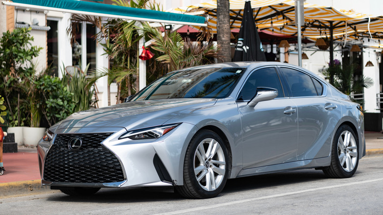 A silver Lexus IS parked