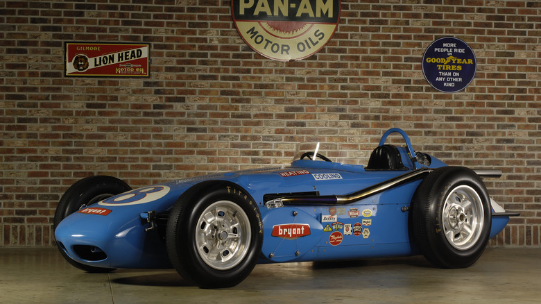 A blue 1960 Watson Indianapolis Roadster in a museum