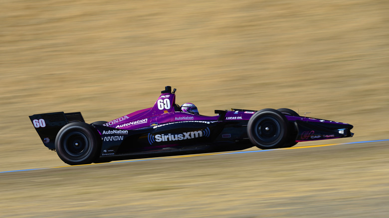 The pink and black 2018 Schmidt Peterson Motorsports IndyCar driving