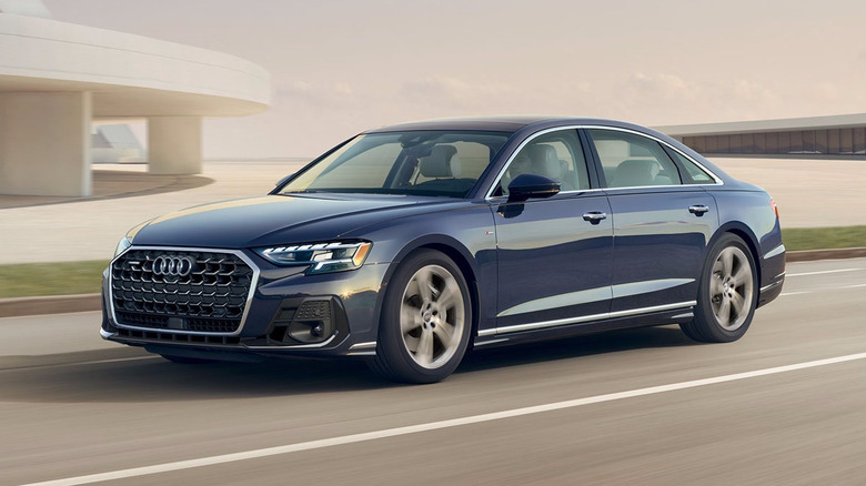 A blue Audi A8 driving on the road