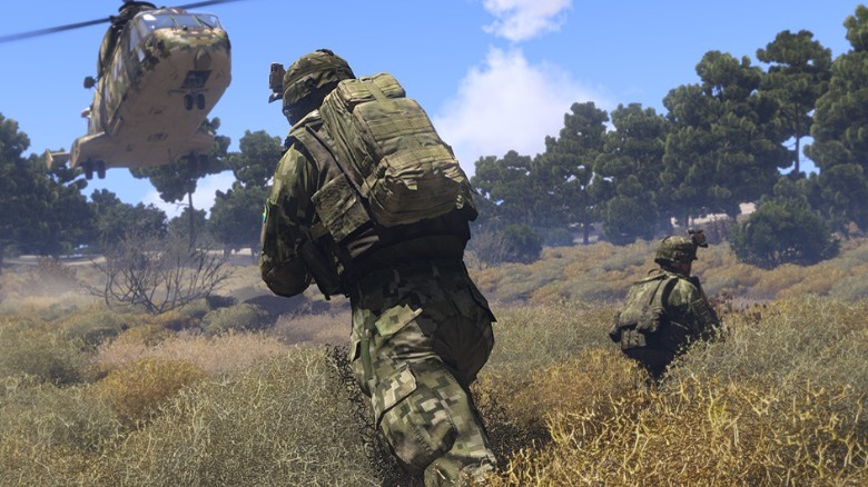 A solider running towards a helicopter in Arma 3