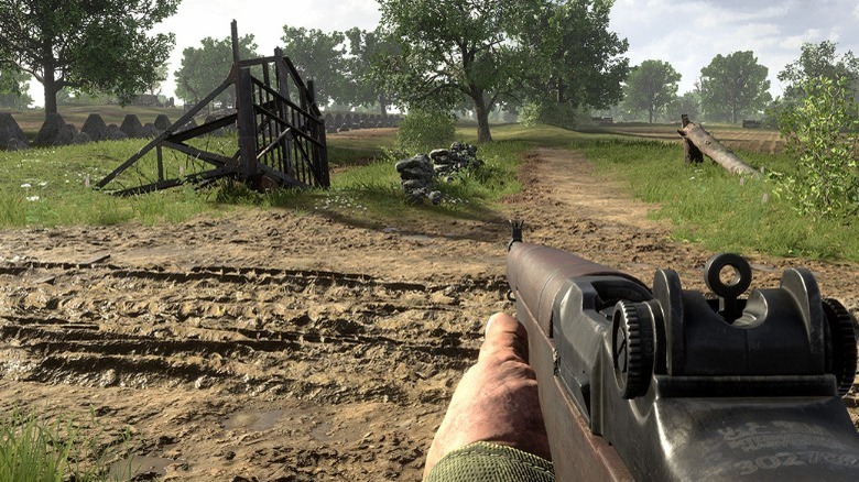 A soldier shooting a rifle in Hell Let Loose