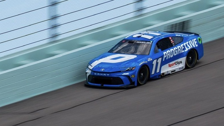 Denny Hamlin's racecar, #11 with blue and white Progressive branding