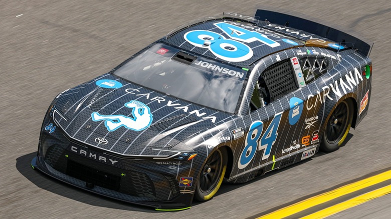 Jimmie Johnson's racecar, #84 with black, white, and blue Carvana branding