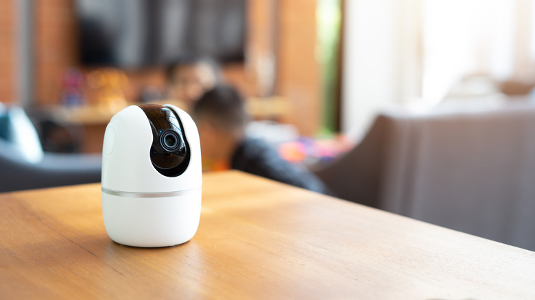 A Wi-Fi security camera kept on a wooden table