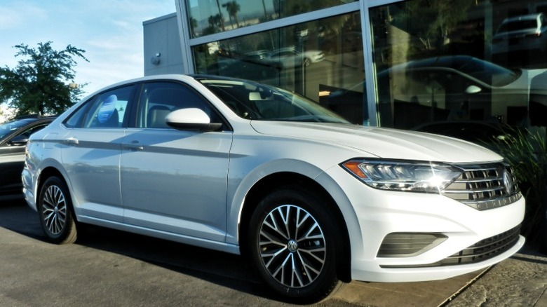 A white Volkswagen Jetta VII