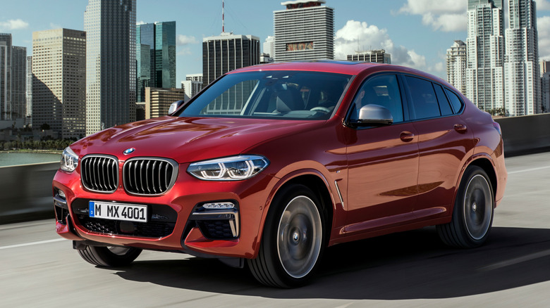 Red BMW X4 M40i in motion