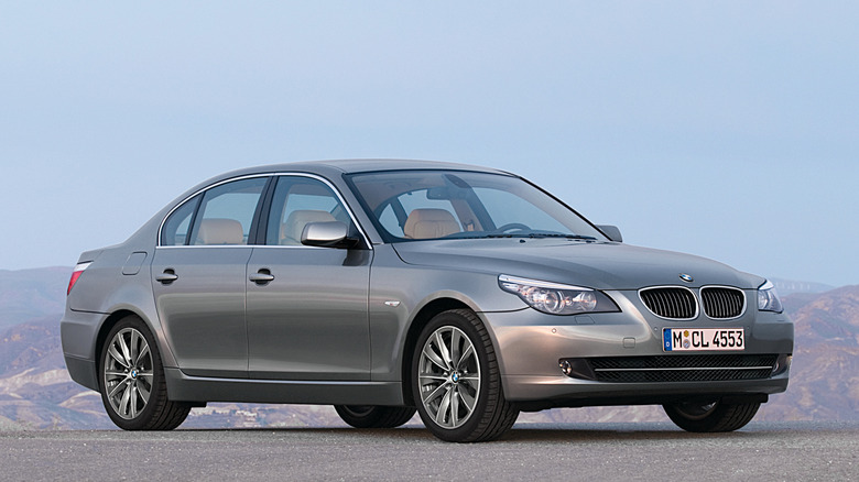 Silver BMW 5 Series Sedan parked