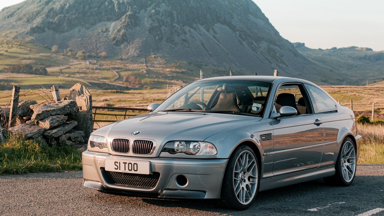 Silver BMW M3 CSL parked on a road
