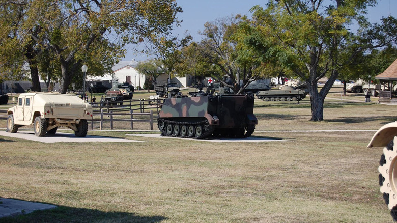 Various military vehicles in a park on Fort Liberty