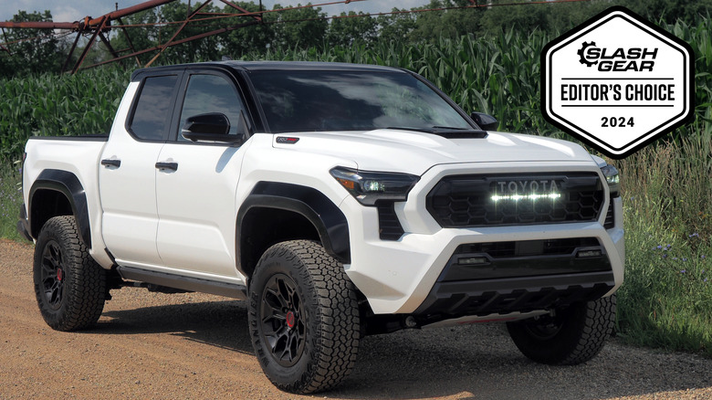 White 2024 Toyota Tacoma TRD Pro front 3/4 view with an Editor's Choice badge from MMtech Online