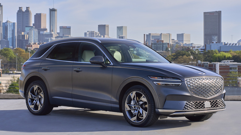Gray Genesis Electrified GV70 parked in a city