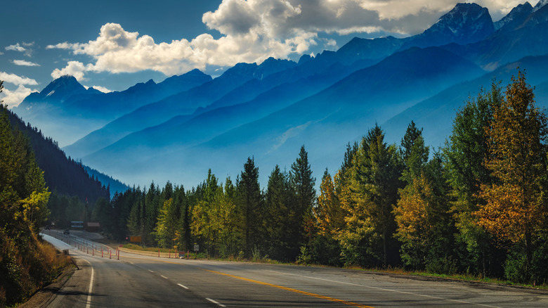 A scenic view of mountains and the Trans Canada Highway in Glacier National Park, British Columbia.