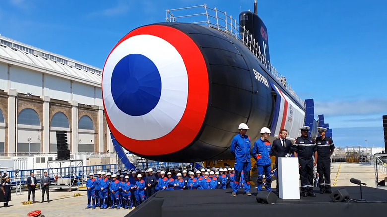 Politicians and military standing in front of Suffren