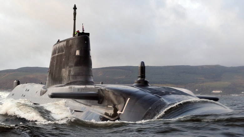 The HMS Astute breaking water on the surface