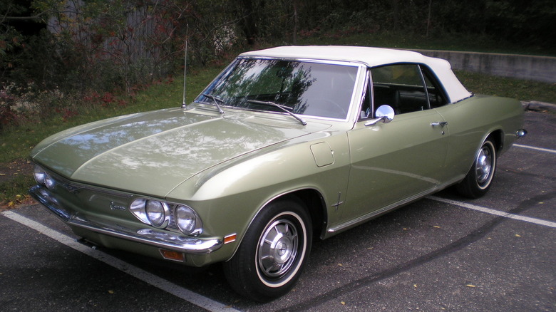 Green 1969 Chevrolet Corvair Monza convertible seen from left front