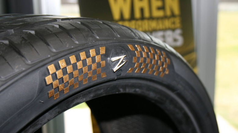 The gold- and diamond-encrusted Z1 tire by Z Tyre on display for a charity auction benefiting the Zenises Foundation.