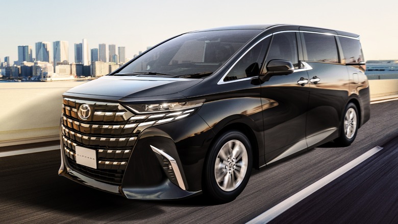 Black Toyota Alphard in motion