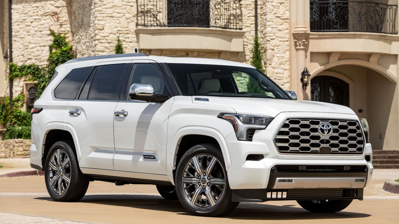 White Toyota Sequoia parked in front of a house