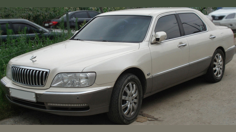 A white first generation Hyundai Equus with a V8 engine