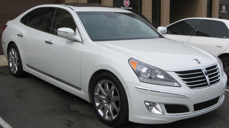 A white second generation Hyundai Equus in a parking spot