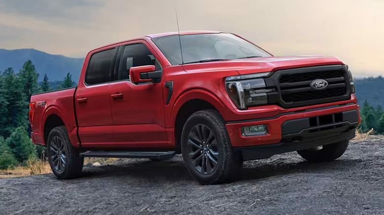 A red Ford F-150 parked on a hill