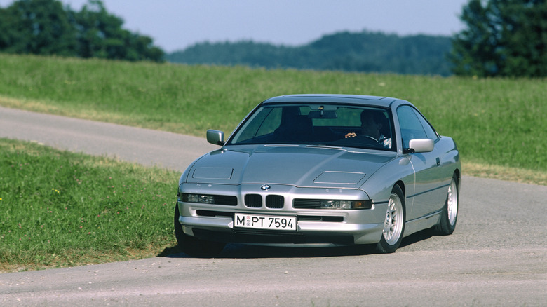 BMW 8 Series E31 cornering at speed front 3/4 view