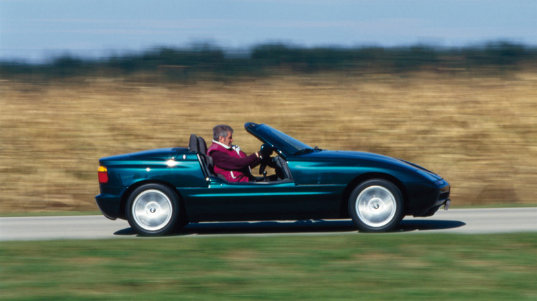 BMW Z1 driving at speed with the doors rolled down side view
