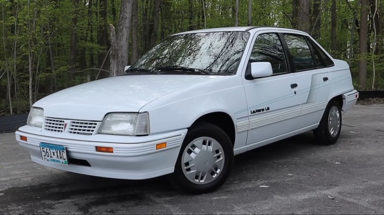 A 1991 Pontiac LeMans LE in the woods