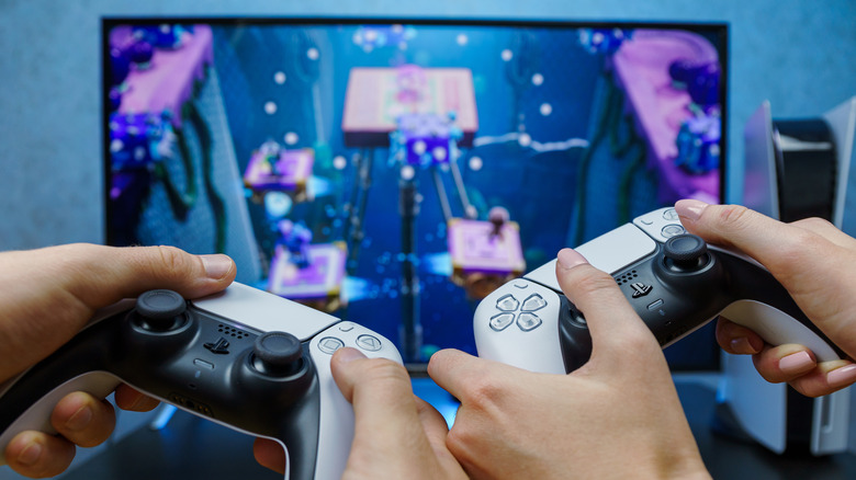 Gamers playing on a PS5 console