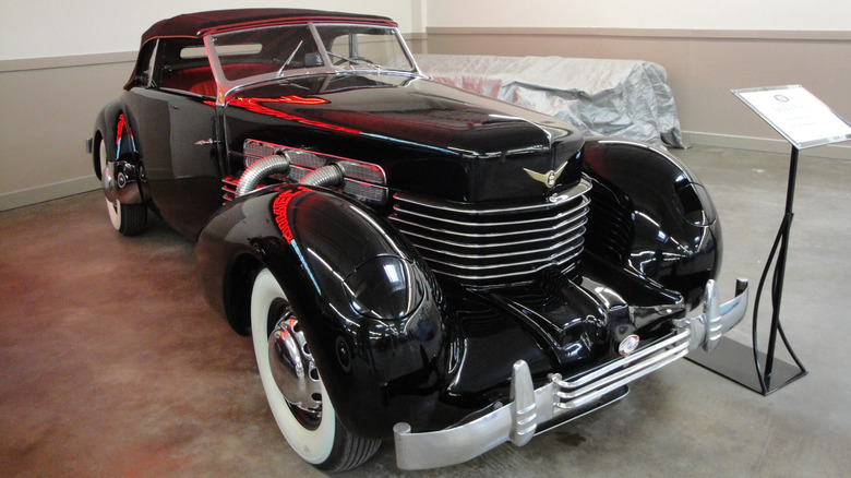 Black Phaeton seen from right front on display indoors