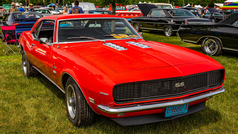 Red 1968 Camaro RS SS seen from right front parked outdoors at car show