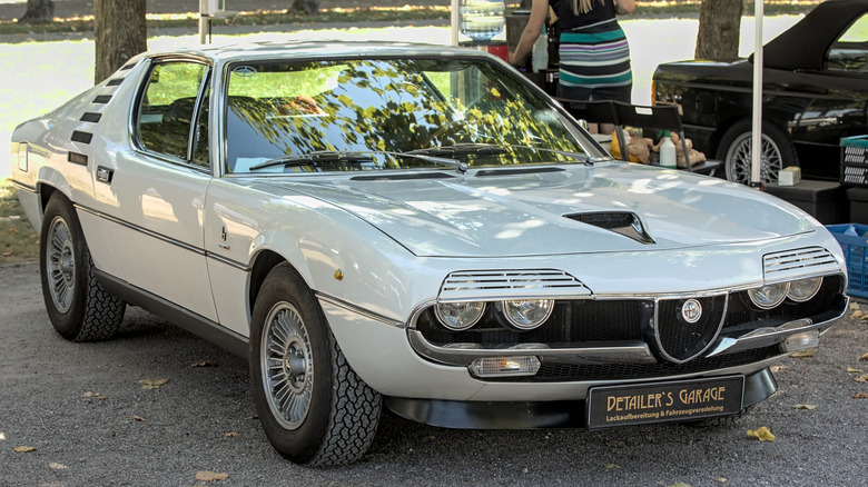 White Alfa Romeo Montreal seen from right front with headlight louvres un-retracted