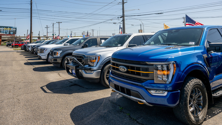 Ford pickup trucks lined up for sale at a Garage in Austin, Texas