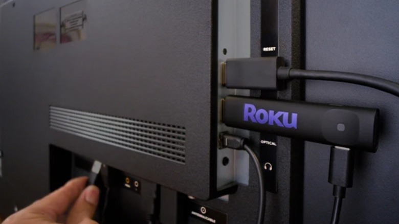 Roku Streaming Stick behind TV