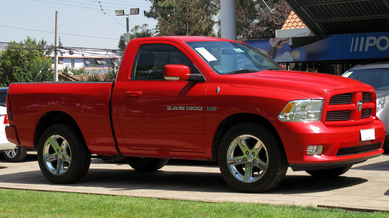 Red 2011 Ram 1500 parked on pavement